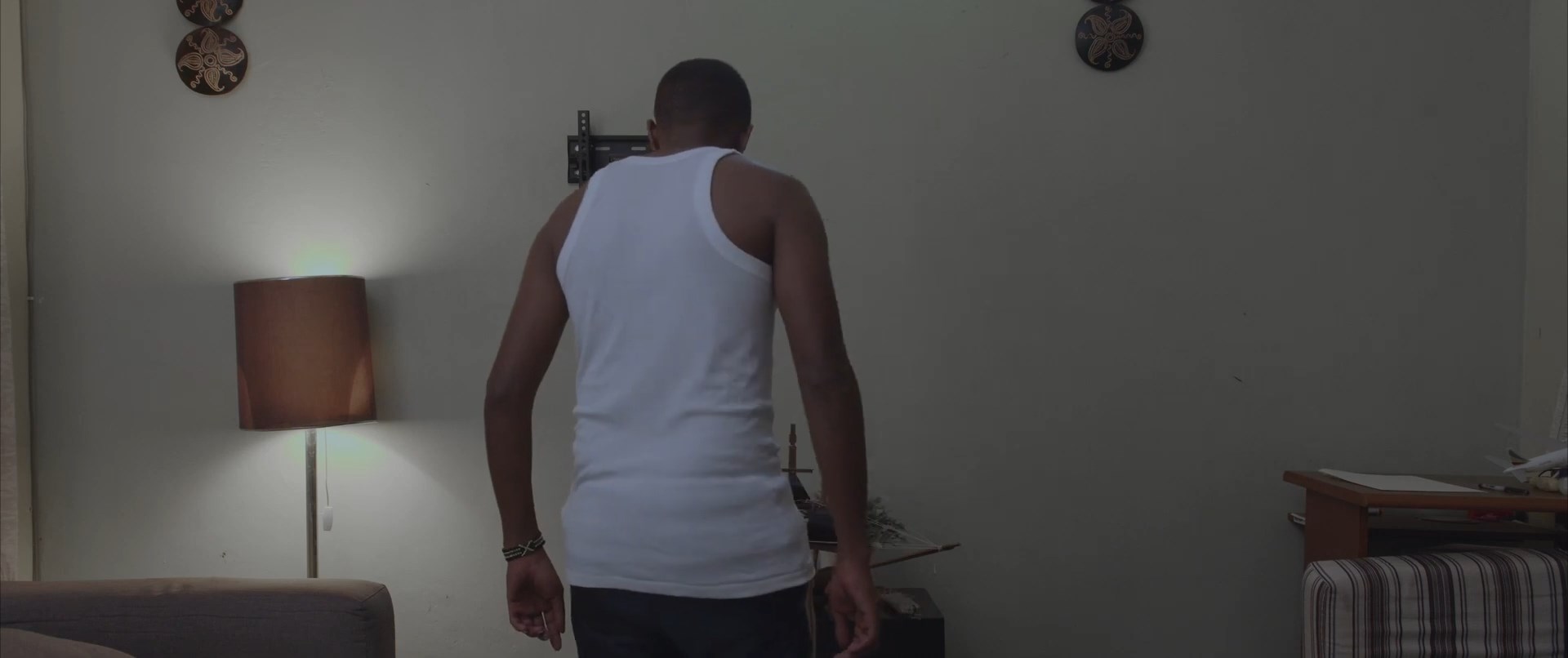 Quincy staring at his phone. cinematic, film